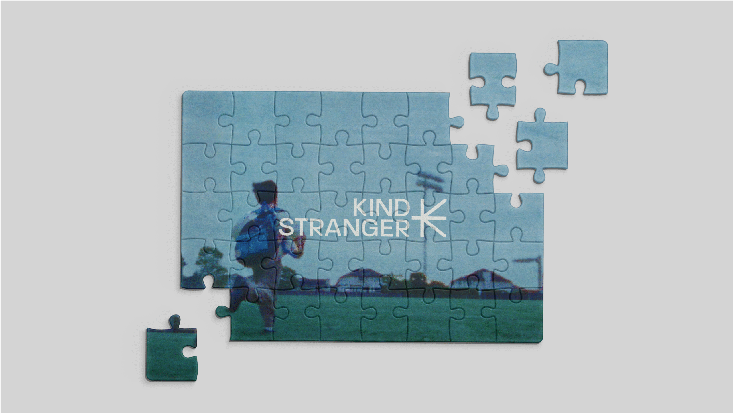 Visual identity for Kind Stranger Productions, highlighting expressive typography, cinematic colour, and human-centered branding.